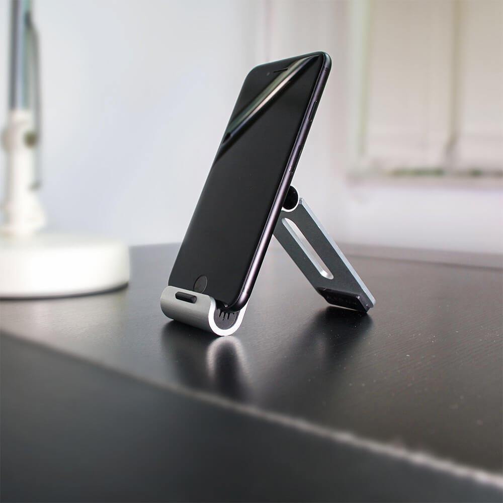ultra thin mini size aluminum folding phone stand in silver with iphone, pocket size cellphone holder